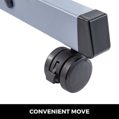 Gray motorized optical instrument table with adjustable height, black casters, and locking wheels.