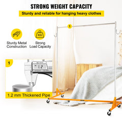 Height adjustable orange steel garment rack with double hooks and four swivel casters.