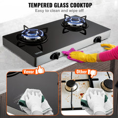 A 28-inch black tempered glass gas cooktop with two blue-flame burners, shown being easily cleaned with a cloth.