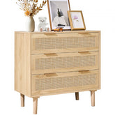 Natural wood dresser with three rattan front drawers and sturdy legs for stability.