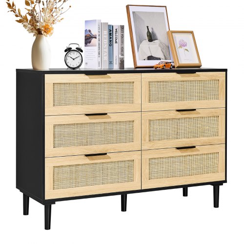 Black boho dresser with six rattan drawers and sturdy legs for storage and organization.