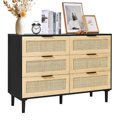 Black boho dresser with six rattan drawers and sturdy legs for versatile storage solutions.