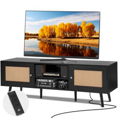 Black boho rattan TV stand with spacious cabinets and a sturdy tabletop for a 65-inch TV.