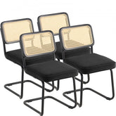 Set of four mid-century modern dining chairs with velvet upholstery and rattan backrests.