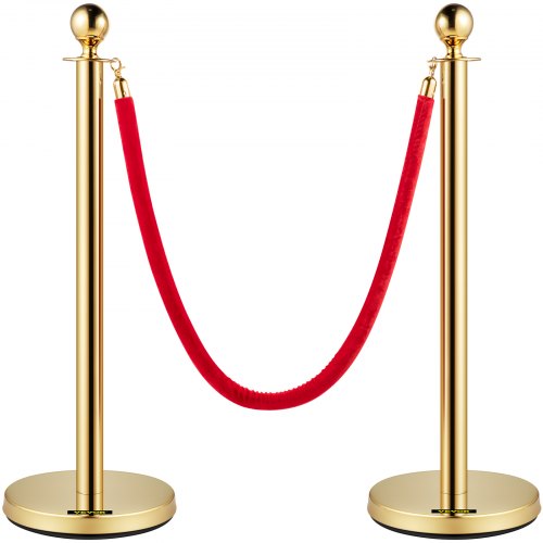 Gold stanchion posts with red velvet rope for crowd control, featuring durable construction.