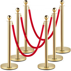 Six gold stainless steel stanchions with 5 ft red velvet ropes, arranged in a line.