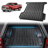 Black TPE truck bed mat for 2019-2024 Dodge Ram 1500 5.7ft bed, with raised edges and textured surface.