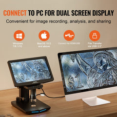 Bostome 10.1-inch IPS LCD digital microscope with 10X-1300X magnification connected to a PC for dual-screen display, showing a magnified coin on the screen.