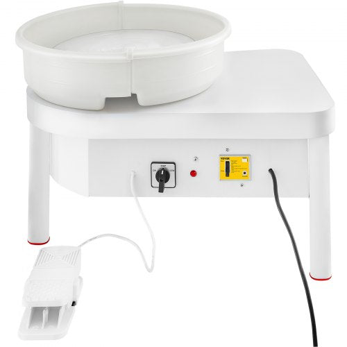White 14-inch electric pottery wheel with foot pedal and control panel on a sturdy base.