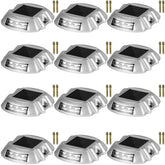 12-pack of silver solar driveway lights with white LED panels and mounting screws.