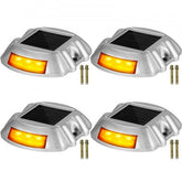 Four orange LED solar driveway lights with waterproof design and durable aluminum shell.