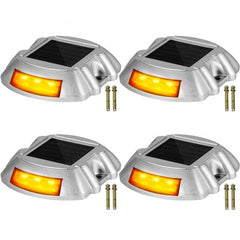 Four orange LED solar driveway lights with waterproof design and durable aluminum shell.