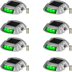 Eight green LED solar driveway lights with a waterproof design for outdoor use.