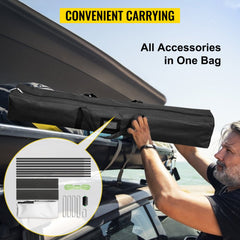 Man carrying a black bag containing the 90-inch outdoor movie screen stand on a rooftop.