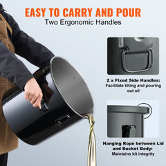Black 10-gallon stainless steel fryer oil disposal bucket with ergonomic handles and lid tether for easy carrying and pouring.