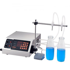 Silver Bostome liquid filling machine with digital display, double nozzles, tubes, foot pedal, and two blue-filled glass bottles.