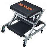 Rolling mechanic stool with padded vinyl cushions and 360° casters for easy mobility.