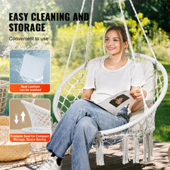 Bostome macramé hanging chair with a cushion, featuring woven mesh ropes and a sturdy frame.