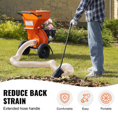 Man using a 4.3in x 13.1ft leaf vacuum hose kit attached to an orange wood chipper on a lawn.