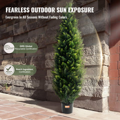 Two 5-foot artificial cedar topiary trees in pots with dense, vibrant green foliage.