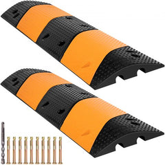 Two black and yellow rubber speed bumps, each 40.2 inches long with two channels and mounting hardware.