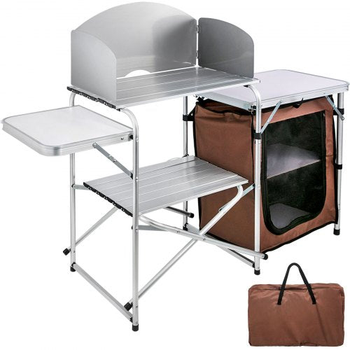 Brown portable folding camping kitchen table with aluminum frame, storage bags, and carry case.