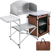 Brown portable folding camping kitchen table with aluminum frame, storage bags, and carry case.