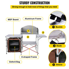 Brown portable folding camping kitchen table with aluminum frame and Oxford bag storage.