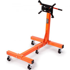 Orange cast iron rotating engine stand with 360-degree adjustable head and lockable casters.