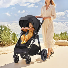 Black 2-in-1 stroller travel system with bassinet, adjustable canopy, and 5-point harness.