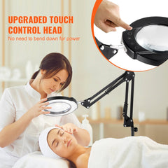 A woman uses a Bostome 5X LED floor magnifying lamp with light and adjustable arm on a client during a facial treatment.