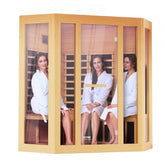 Wooden far infrared sauna room for 3-4 people with three women relaxing inside.