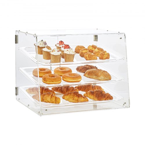 Clear acrylic 3-tier pastry display case with croissants, donuts, and cupcakes on trays.