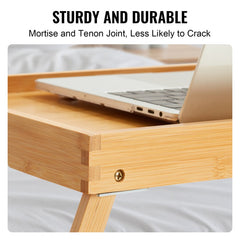 Two foldable bamboo bed tray tables with a smooth, waterproof surface and sturdy legs.