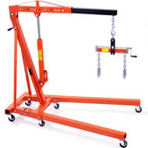 Orange 2-ton foldable hydraulic engine hoist with boom, leveler, chains, and casters.