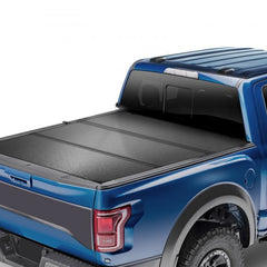 Black tri-fold tonneau cover for 2015-2024 Ford F-150 with a 5.5' bed.