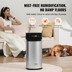 A woman relaxes on a couch with a golden retriever beside a black and silver Bostome 10L evaporative humidifier in a cozy living room.