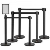Bostome 6-pack crowd control stanchions with retractable belts and stable metal bases.