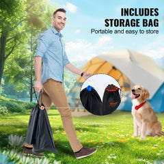 Man carrying a black storage bag with dog agility cones and rods in the background near a tent.