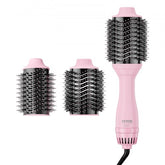 Pink Bostome ionic hair blow dryer brush with two detachable round brush heads and black bristles