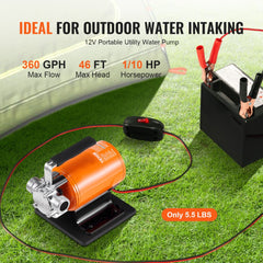 Orange 12V portable water transfer pump with 360 GPH flow, connected to a battery on grass.