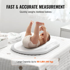 White baby scale on a surface with a smiling infant lying on it, legs raised.