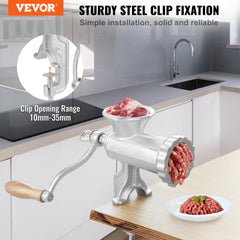 Heavy-duty cast iron manual meat grinder with stainless steel clamp and multiple cutting plates.