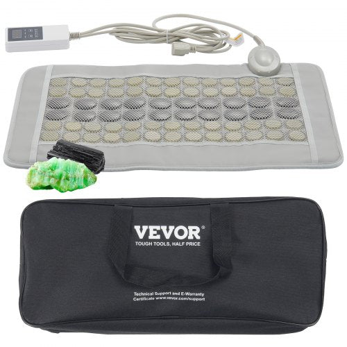 A gray heating pad with jade and tourmaline stones, a controller, and a black carrying bag.