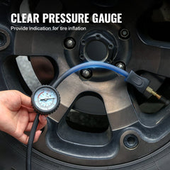 Hand holding a tire pressure gauge attached to a car wheel valve.