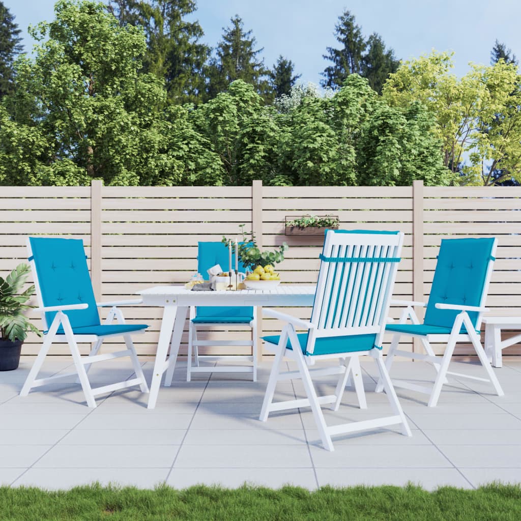 Four Bostome blue polyester highback chair cushions, 47x20in, on white patio chairs around a table.