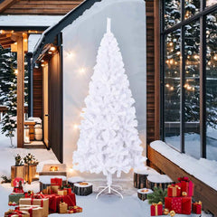 An 8 ft white artificial Christmas tree with PVC branches and metal stand, displayed outdoors in a snowy setting with decorations.