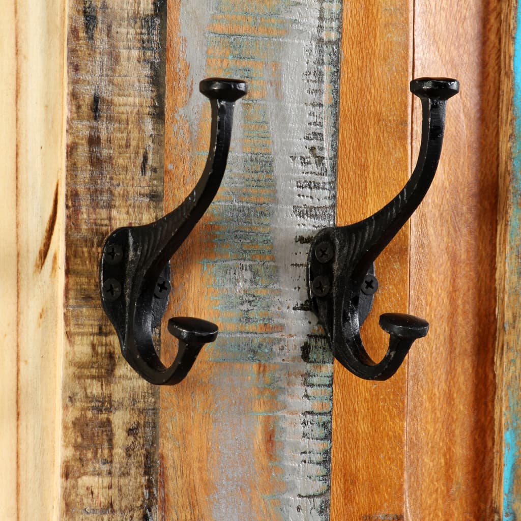 Two reclaimed wood coat racks with black iron hooks mounted on a wooden wall.