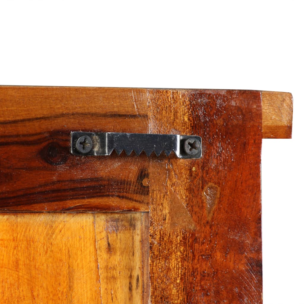 Close-up of reclaimed wood coat rack edge with metal sawtooth hanger for wall mounting.
