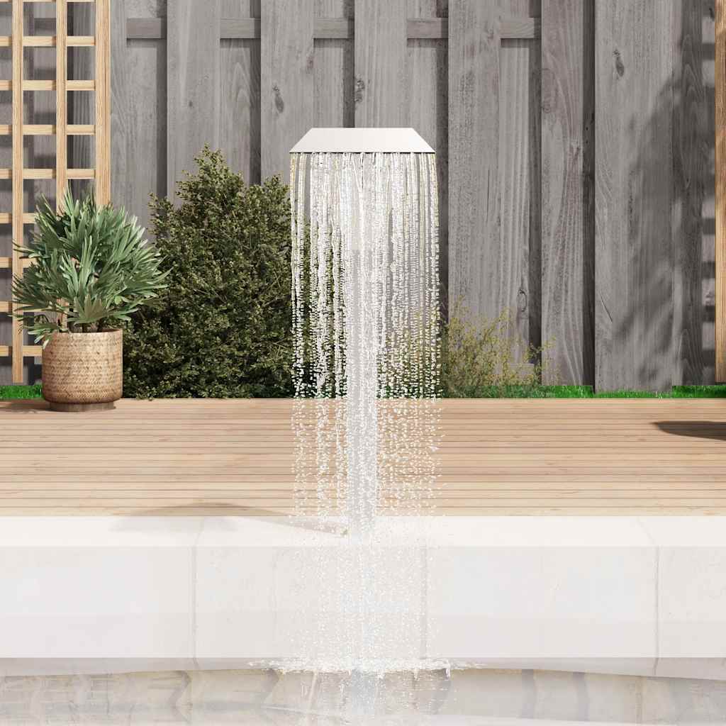 Silver stainless steel pool fountain with cascading water sheet, 19.7x11.8x35.4 inches, on wooden deck by pool.